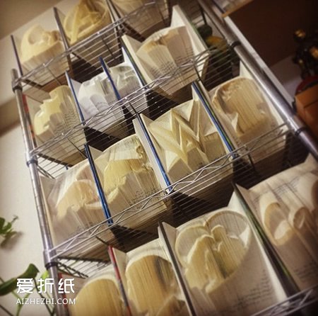 大部头书籍的废物利用 制作出震撼的纸雕作品- www.aizhezhi.com