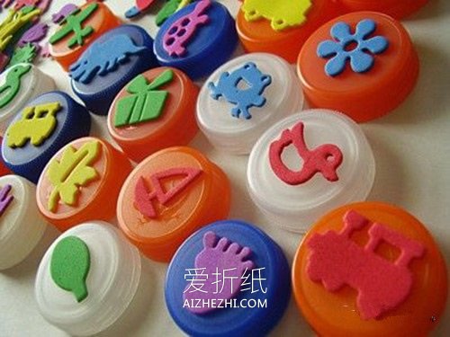 怎么把瓶盖废物利用 幼儿园瓶盖手工小制作- www.aizhezhi.com