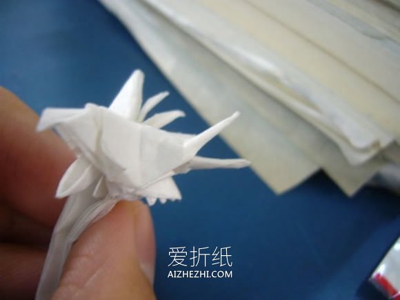 怎么折纸龙头戒指的方法 手工龙之指环的折法- www.aizhezhi.com