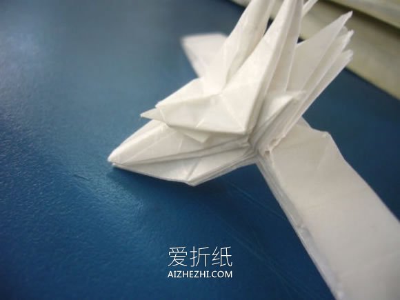 怎么折纸龙头戒指的方法 手工龙之指环的折法- www.aizhezhi.com