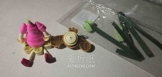 怎么做衍纸女孩图解 花丛中的小女孩衍纸教程- www.aizhezhi.com