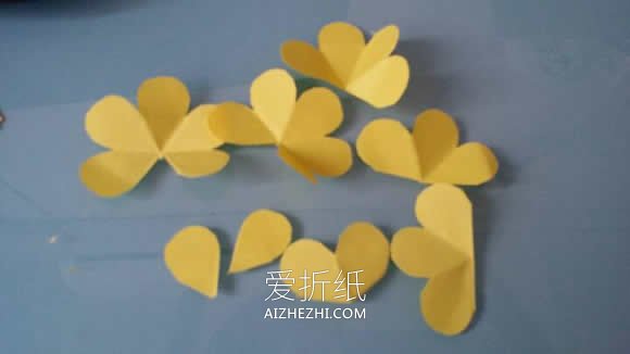 怎么用彩纸做山茶花的手工教程图解- www.aizhezhi.com