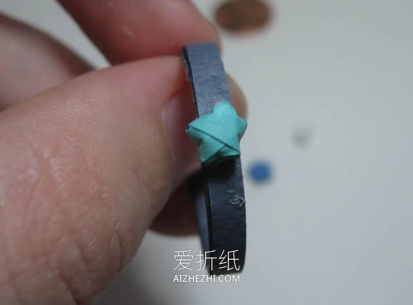 怎么手工折纸制作幸运星戒指的方法图解- www.aizhezhi.com